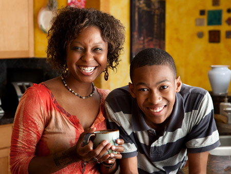 smiling teenage son with his mother